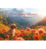 Carte avec verset Chiot  dans un champ de fleur dans la montagne