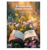 Carte Avec Verset Bible posée dans un champ de fleurs